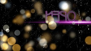 Neon Open sign behind the glass. Across a rainy window with a neon open sign behind the glass.