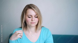 Beautiful woman puts on stylish glasses. Girl wears eyeglasses. Glasses closeup. Girl in glasses
