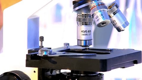 clip-3971226403-sars-virus-under-microscope-supporting-research-understand