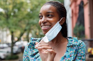 Aja Carthon shows off what her mask has been hiding