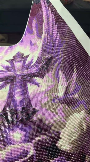 A completion on purple cross diamond painting..love it￼