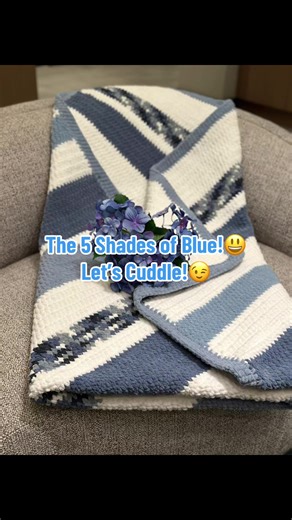 This stunner is called The 5 Shades of Blue!😉. Not only is the color palette full of color in the shades of blue, but is absolutely soft and squishy to the touch. Definitely Cuddle Worthy! I was proud to use different weights of yarns to pull off this stunning 52x60 throw blanket. Had a great time perfecting this blanket! It was a requested blanket for a wonderful colleague. Jenn M. I hope you love this blanket as much as I do! Thank you for your support!🥰 #crocheting #crochetersoftiktok #croc