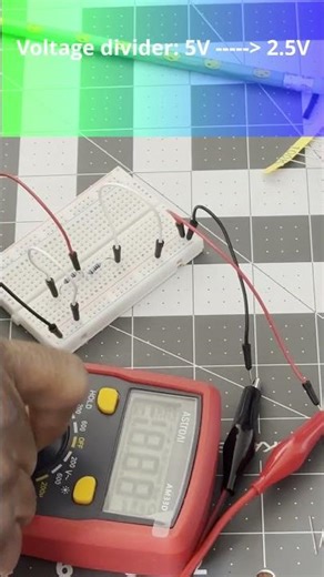 Simple Voltage divider with two 100k resistors.