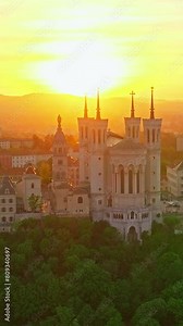 Lyon historical city center with streets aerial drone vertical video footage. Warm summer evening. Sunlight Lyon aerial Lyon France. Famous tourist holiday vacation destination in France, Europe