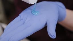 Professional squeezes face gel from a tube. Cosmetology