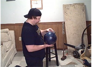 Tallest Dice Tower Stacked On A Bowling Ball Held In Hand