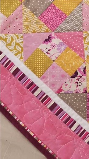 Cute baby girl quilt with flower appliques. Blooming Meadow quilt pattern