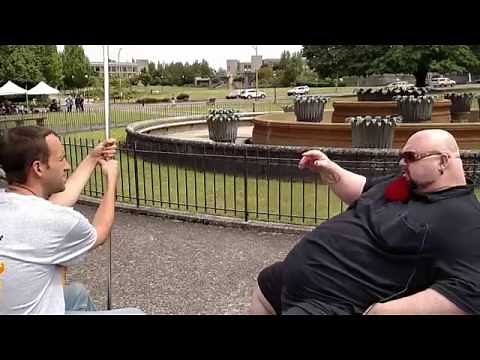 Atheist in a Wheelchair challenges a street preacher.