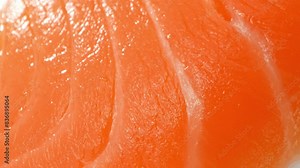 Exquisite sashimi-grade salmon, radiant in its vibrant orange hue, embodies unparalleled freshness. Each delicate slice, meticulously cut, unveils the epitome of culinary perfection.