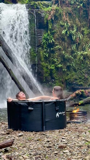 Pure bliss. Our smaller, lighter 2 seater portable hot tub under a waterfall
