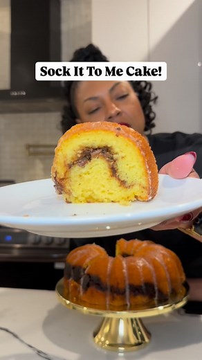 Janelle Nichole on Instagram: "Easy Southern Classic from Cake Mix!! Sock It To Me Cake Recipe Cake Ingredients: • 1 package yellow cake mix (15.25 oz) • 4 eggs, room temperature • ¼ c milk, room temperature • ¼ c powdered sugar • 1 c sour cream, room temperature • ¼ c vegetable oil • ¼ c butter, melted • 1 tsp vanilla extract Filling Ingredients: • ½ c chopped pecans • ½ c dark brown sugar • 2 tsp ground cinnamon Icing Ingredients: • 1 c powdered sugar • 1-2 tbsp milk Instructions: 1. Preheat o
