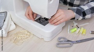 Vegetables in a mesh shopping bag and plastic wrapped on a rustic kitchen table, say no to plastic, using reusable shoppers, zero waste lifestyle, plastic bags and food trays versus eco bag