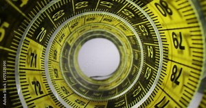 Yellow black tape measure on table for important measurements