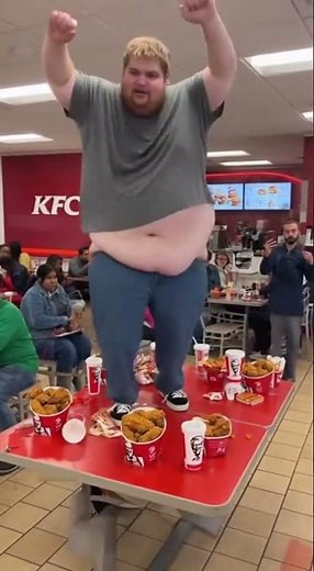 Fat Man Goes WILD Dancing on KFC Table!
