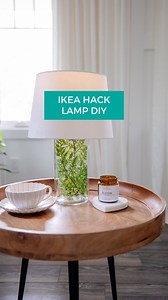IKEA hack time! Let's create a cordless lamp out of the IKEA VARDAGEN jar. It's tall and slender, so I thought this jar was the perfect shape for a lamp base. You can fill the jar with anything you like (I think it would be fun to switch out seasonally), but I chose to fill it with some faux fern stems from my own shop, @cozyprairielinens. I thrifted a lamp shade for the top, then added a remote operated light bulb from Amazon. I love how this DIY lamp looks in front of my living room windows as