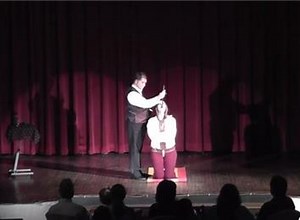 Fastest Straitjacket Escape While Swallowing A Sword