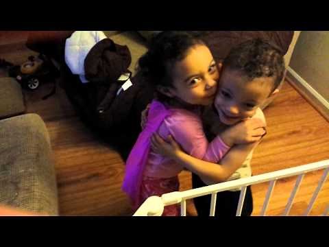 Twin sister cheers up mad brother with a kiss