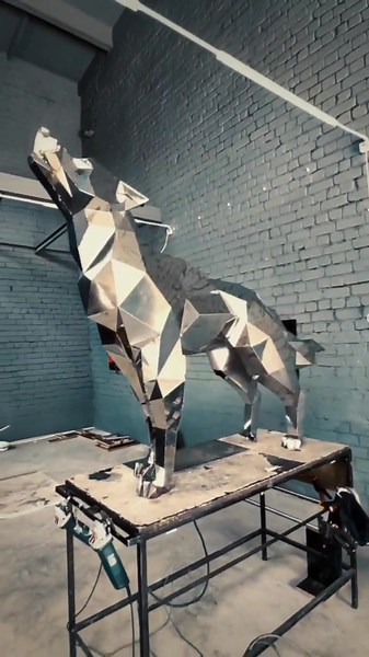 Stunning Metallic Wolf Sculpture: A Modern Art Piece
