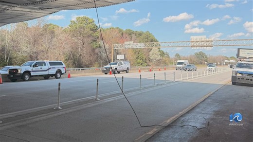 Power line dangling from I-64 overpass damages cars