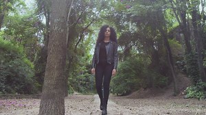 Girl walking slowly through a forest - Free Stock Video