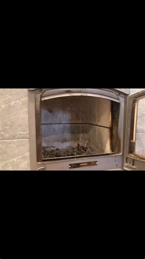 Hearth + Timber on Instagram: "Loading a @tulikivi soapstone stove. Top down burn for clean, vigorous combustion. The fire travels through a series of channels before entering the chimney, charging 5000lbs of stone for gentle radiant heat that lasts 12 hours."