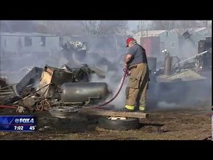 Man welding in yard sparks Palmer brush fire