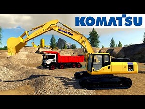 KOMATSU PC300 Excavator Loads Gravel Into A Scania Dump Truck