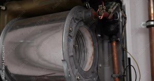 Maintenance, plumber and repair service engineer working with house gas heating boiler. Professional worker servicing the heating system. Repairs Gas boilers.