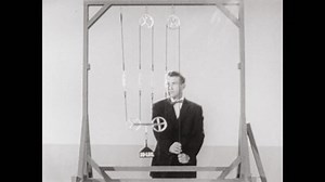 1950s: Two movable pullies are set up in lab. Five pounds of pressure are measured on each pulley rope.