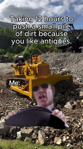 Small Antique Bulldozer Pushing Small Pile Dirt