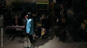 Long shot of jazz players performing live music at the cozy LOFT place