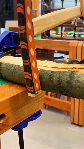 Manual Bow Saw Cutting Through Wood Log For Professional Woodworking Projects