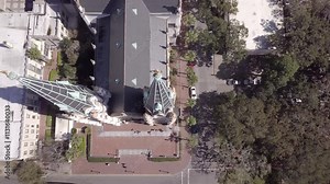 Dolly action aerial shot of people exiting the Cathedral of St John the Baptist in Savannah, Georgia.