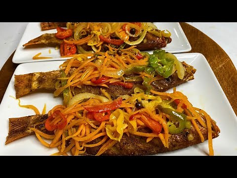 Escovitch Fish, Jamaican Style, Fried Snapper topped with pickled vegetables sauce.