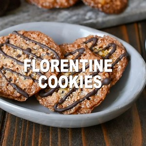 ✅ Full recipe > https://culinaryginger.com/florentine-cookies/ Italian Florentine Cookies are lace cookies made from chopped almonds with orange & vanilla. They are then sandwiched with chocolate and you get the most delicious cookies. Serve with hot espresso or coffee to transport you right to Florence, Italy. Crunchy and almost toffee-like, the flavor combinations are just perfect. #florentine #florentinecookies #florentines | Culinary Ginger - Authentic Recipes, Honest Ingredients