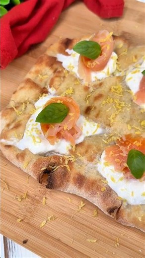 Pinsa with stracciatella, salmon, and lemon