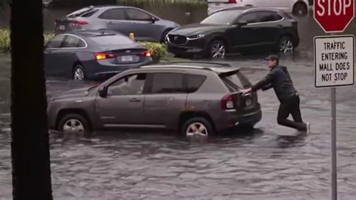 NBC reporter pushes car out of water as severe flooding hits South Florida