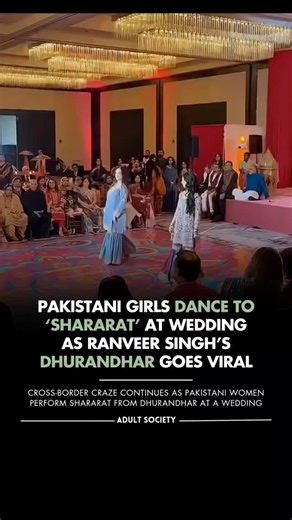 THE ADULT SOCIETY on Instagram: "Bollywood’s influence clearly knows no borders 🌍 A wedding video from Pakistan is going viral, showing women dancing joyfully to ‘Shararat’, the hit track from Dhurandhar. The film, starring Ranveer Singh, has not only dominated the box office but also taken over social media feeds across countries. What’s grabbing attention is how the song continues to trend and spark celebrations despite official restrictions. Netizens are calling it another reminder of Bollyw