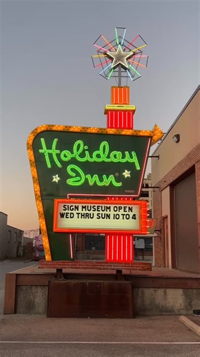 Rolando Pujol on Instagram: "It’s Motel Monday, and an original, gloriously restored Holiday Inn “Great Sign” is a fabulous way to celebrate! Indeed, there is none quite like it still among us. The beauty puts on its nightly neon spectacle at the American Sign Museum in Cincinnati, a bucket-list destination if there ever was one for roadside Americana enthusiasts. (And the @americansignmuseum – and this “Great Sign” – is in my book, “The Great American Retro Road Trip.”) Holiday Inn was founded