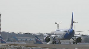 Plane moving around an airport - Free Stock Video