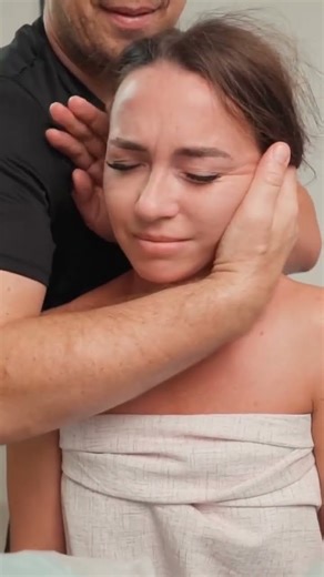 Anna experiences ASMR neck cracking — gentle holds, soft twists, and crisp sounds release deep