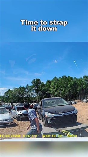 Loading a car onto a trailer that I bought at auction