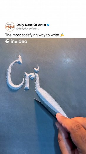 2.7K views · 72 reactions | This artist creates mesmerizing calligraphy using only sand and a simple card. Each stroke flows with patience and precision, turning handwriting into a soothing visual experience. Whose name should they write next? ✍️ Artist: @sandcalligraphy #art #artist #calligraphy #writing #satisfying #ASMR | Daily Dose of Artist | Facebook