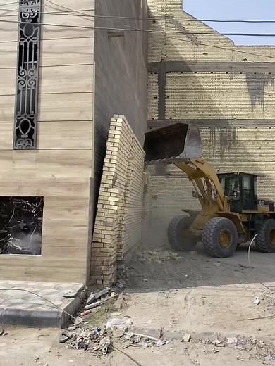 Demolition Process at Construction Site with Front Loader