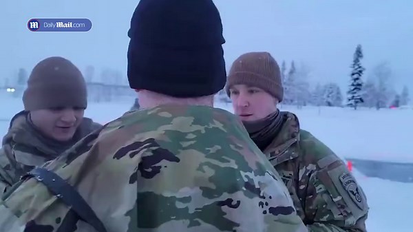 US Army troops do polar plunge during Alaska training