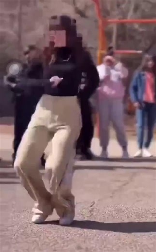 A young woman in Iran dances with her hair uncovered. To the regime, that's two "crimes": no hijab and dancing. To the world, she's a symbol of courage. | Hananya Naftali