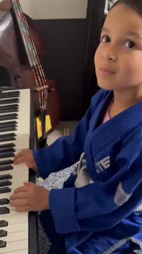 Olivia practicing some piano before heading to Jiu Jitsu 🎹 Maybe one day she’ll be the 1st Grammy Award winning UFC Champion in history | Hermanos Herrera