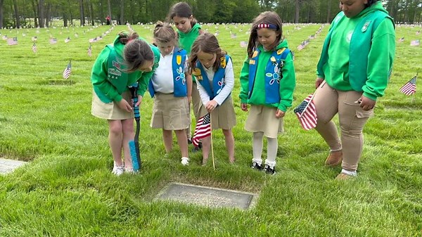 Girl Scouts plant 500 flags at Calverton National Cemetery