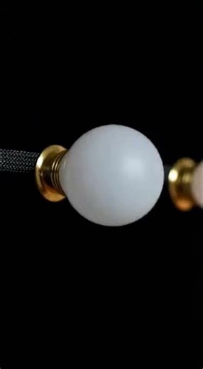 Light begins from a point and pulses into the night.