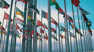 International flags of different countries waving in the wind on flagpoles - Ukrainian, Norway, Poland, Canadian, Georgian, Armenian, Lithuanian, Austrian and more